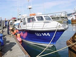 The first Out the Blue, alongside in harbour
